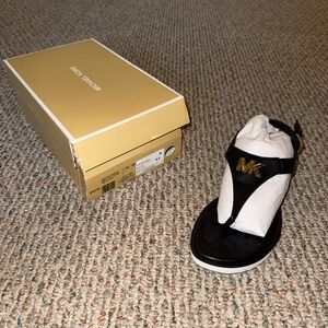 Michael Kors Black and Gold Flip Flops